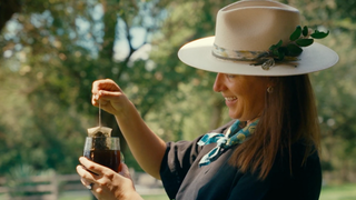Abianne Falla brewing yaupon tea outside