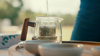 Yaupon Tea Brewing in a Clear Mug Outside